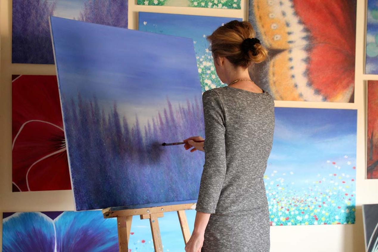 Kirstin McCoy painting in her Art Studio